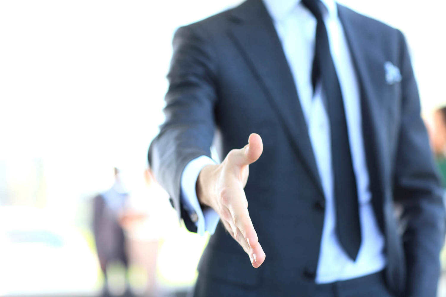 A Business Man With An Open Hand Ready To Seal A Dea